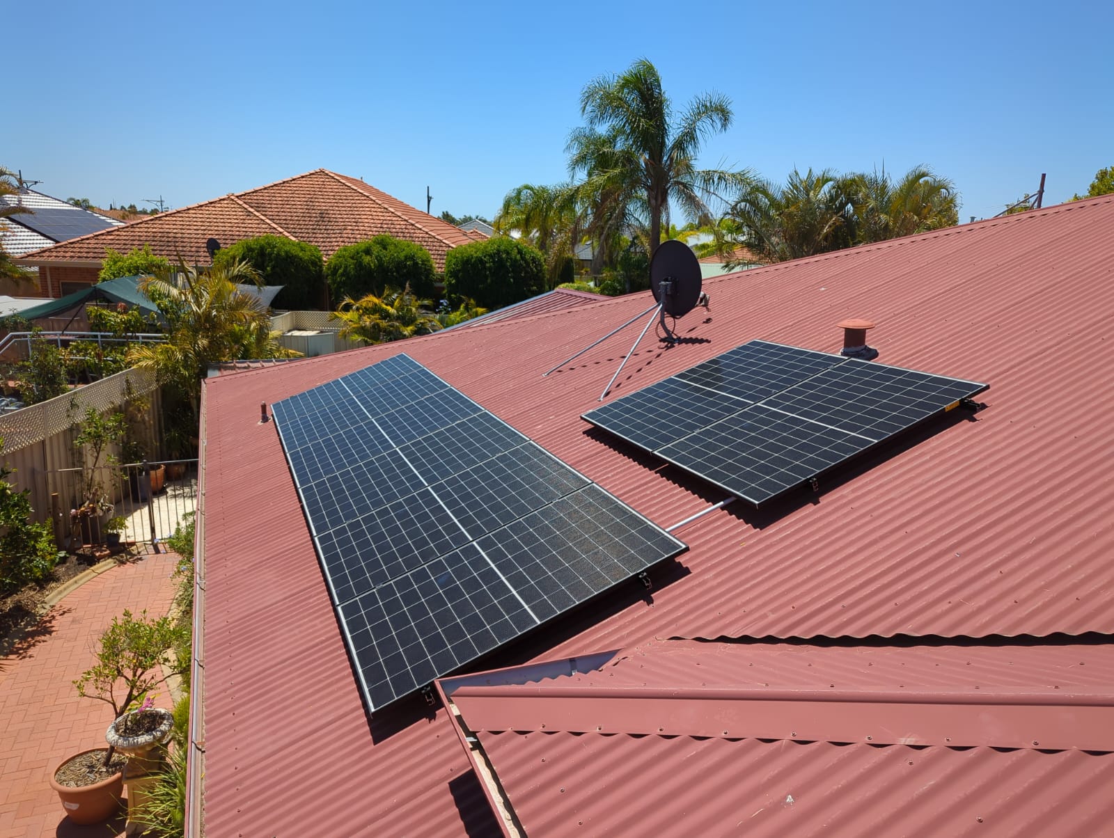 Wide view of solar panels installed by DMG Solar on a Canning Vale rooftop
