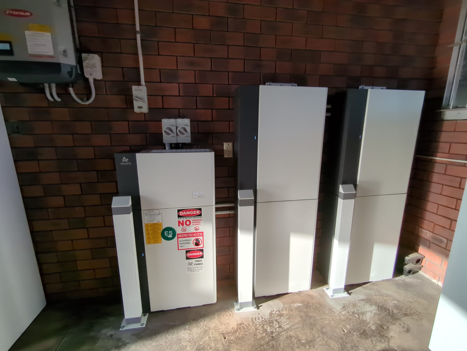 AlphaESS battery system with Fronius inverter installed in a Greenwood garage