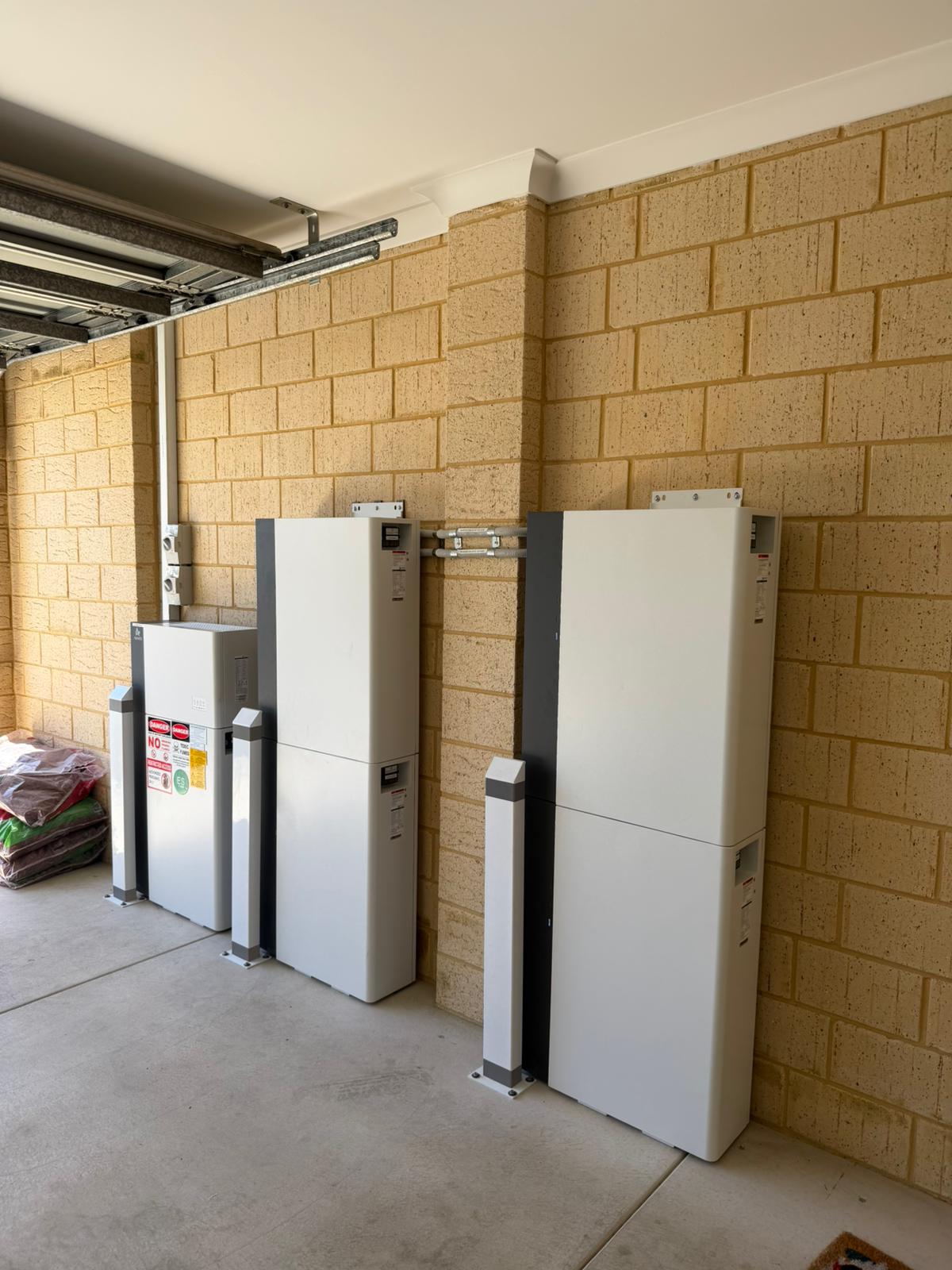 DMG Solar battery installation with safety signage in Harrisdale