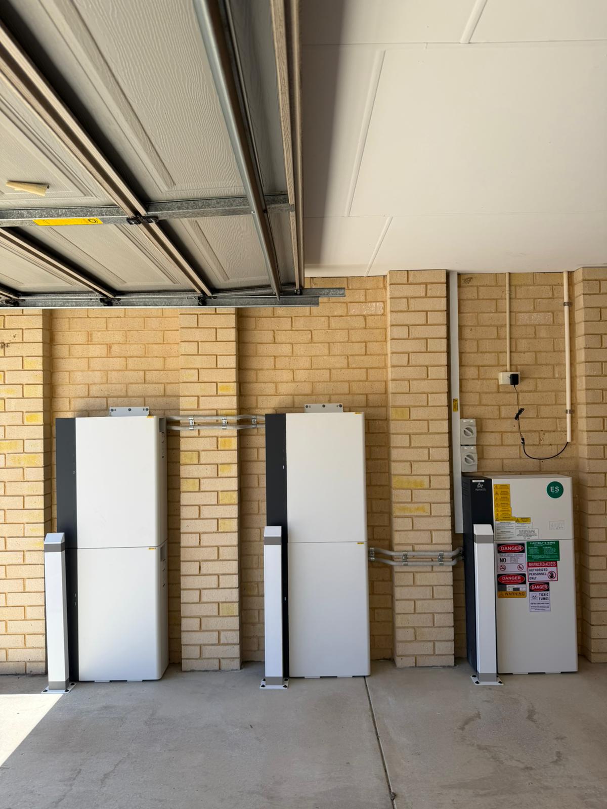 Twin AlphaESS battery towers in the Harrisdale garage