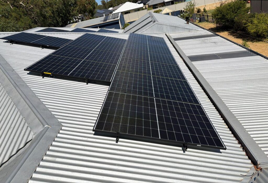 Two AlphaESS inverters and battery towers under garage roof in Hilbert