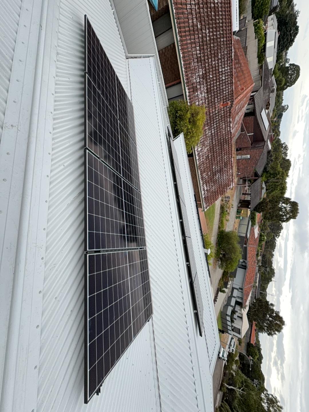 Solar panels installed by DMG Solar on a Leeming rooftop