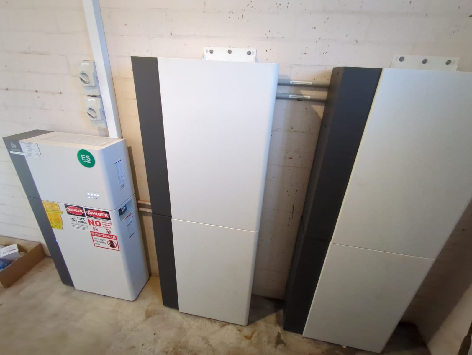 Three AlphaESS battery cabinets installed in a Murdoch garage