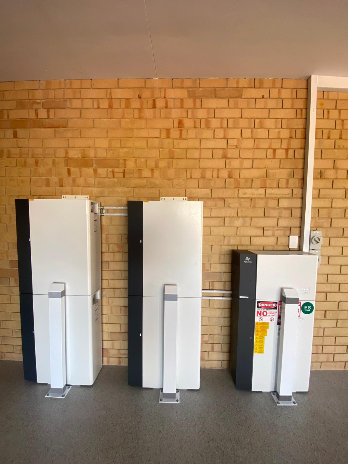 AlphaESS battery cabinets and inverter with safety bollards