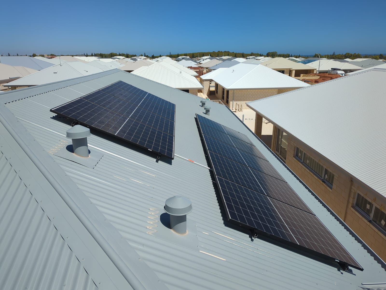 Aerial view of solar panels on a Two Rocks roof