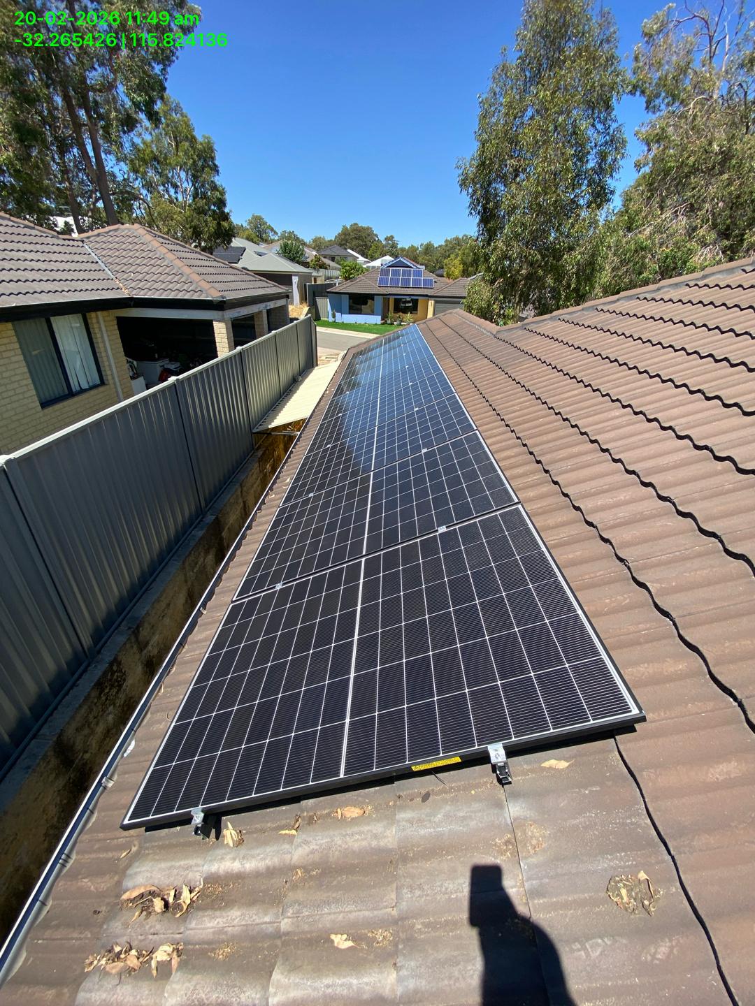Long row of solar panels on a tiled roof in Wellard