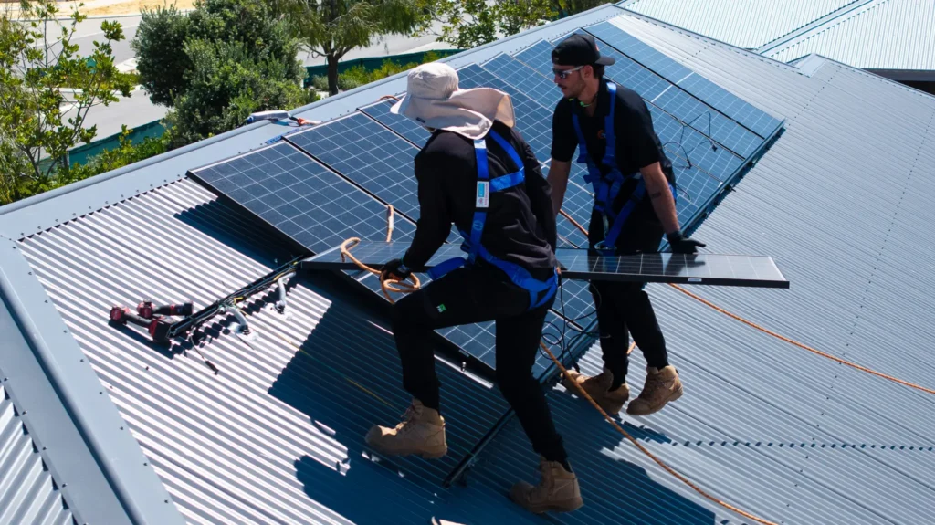 DMG Solar Installation Team on the roof of a Perth home installing solar panels