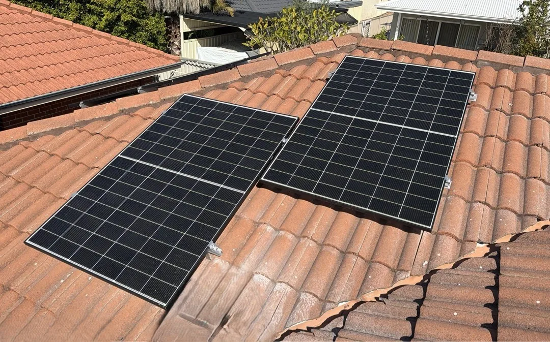Two groups of Trina Vertex S+ panels on a terracotta roof