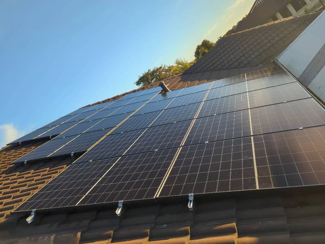 15.2kW of solar panels in rows on a charcoal concrete tiled roof in Butler