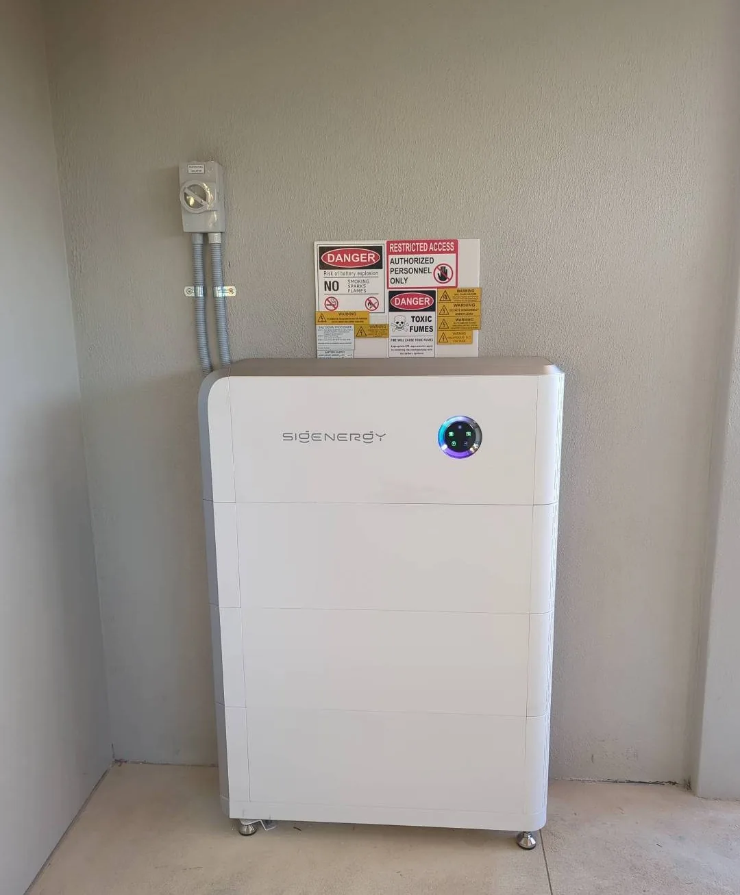 Sigenergy SigenStor 27.12kWh battery with isolator and safety signage