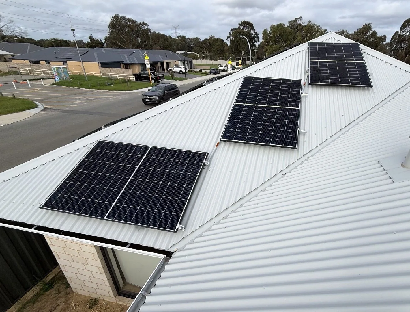 Trina solar panels in small groups along a Colorbond ridge in Dayton