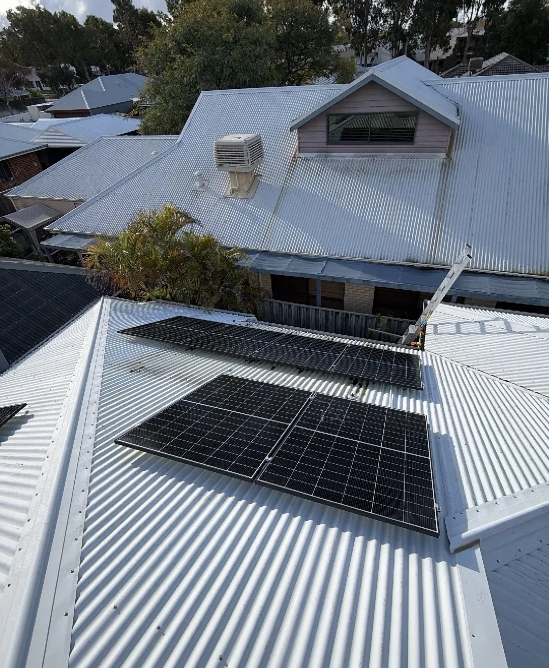 Two groups of Trina Vertex S+ panels on a Colorbond roof in Ellenbrook