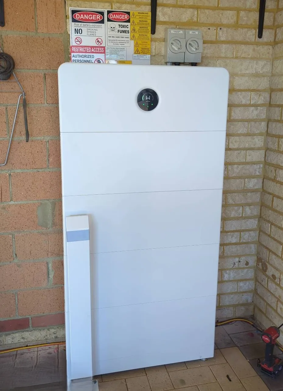 GoodWe ESA 33.28kWh battery stack in a sheltered brick corner in Gwelup