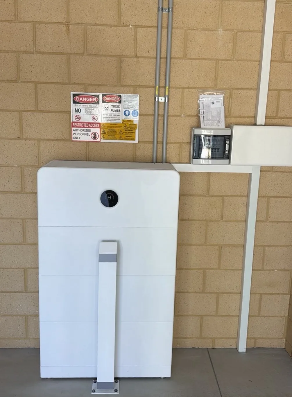 GoodWe ESA 24.96kWh battery and inverter installed in a Kardinya garage with safety bollard