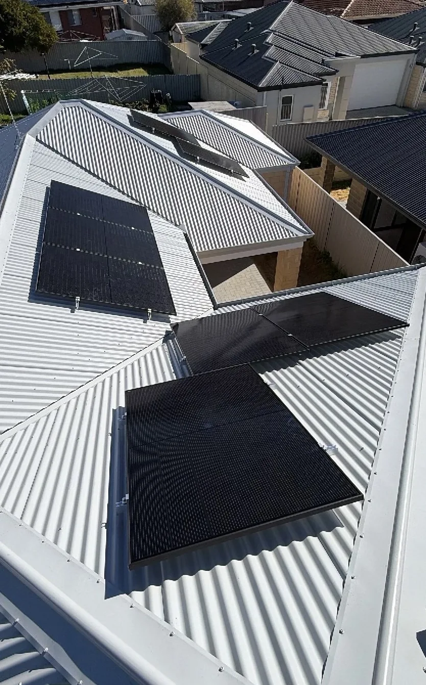 Jinko solar panels split across several roof faces on a Kardinya home