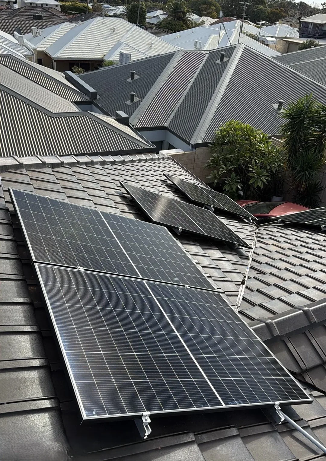 Close view of Trina Vertex S+ panels mounted on concrete roof tiles
