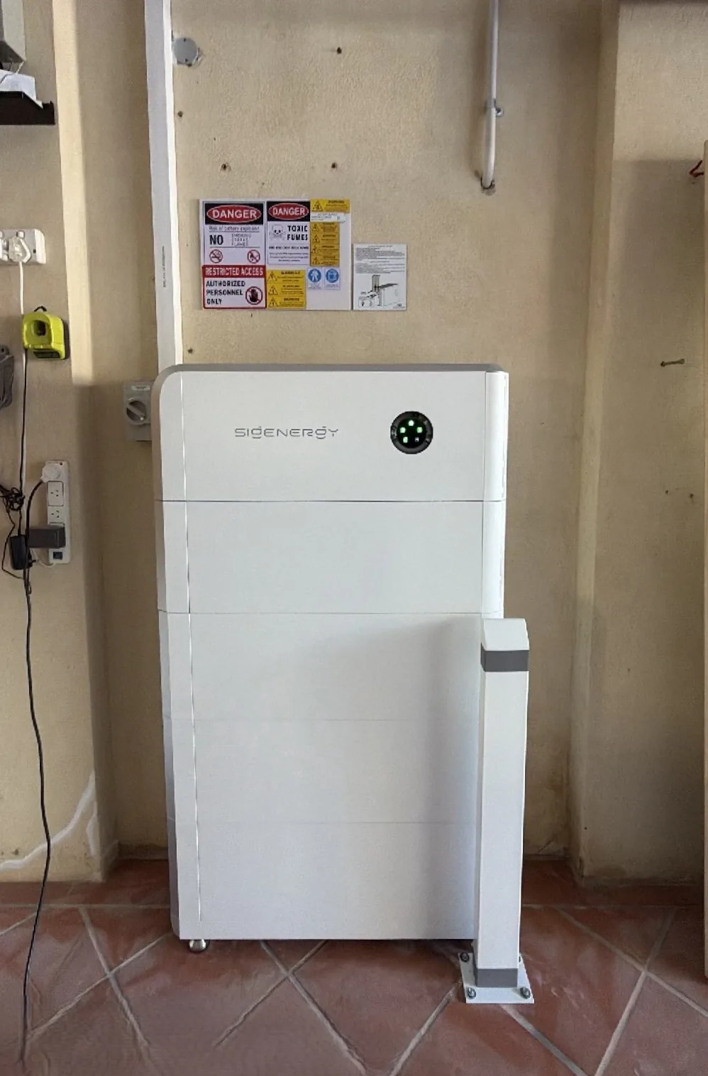 Sigenergy SigenStor 36.16kWh battery stack with safety bollard in a Salter Point garage