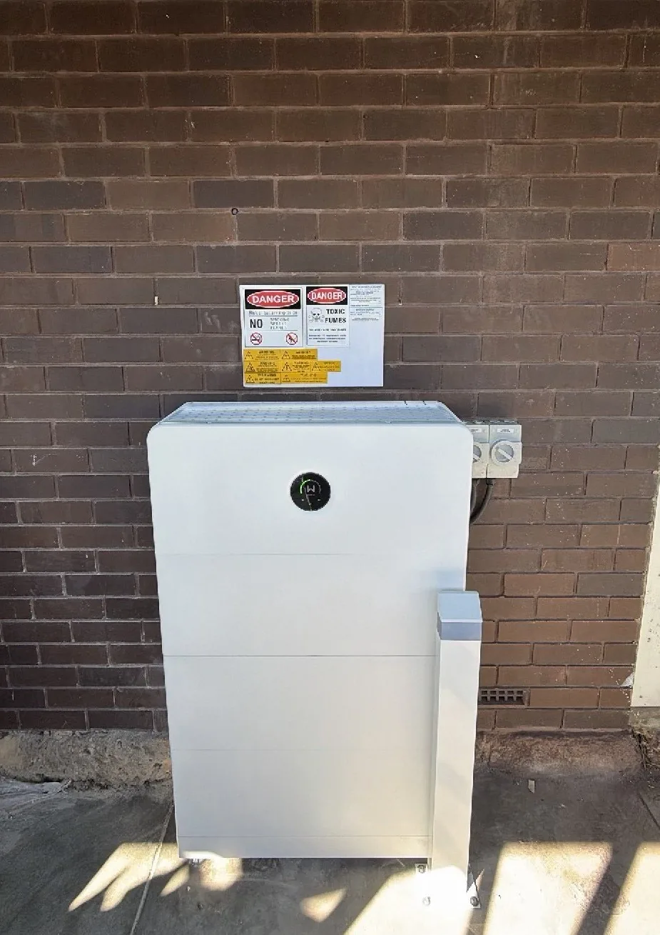 GoodWe ESA 24.96kWh battery mounted outdoors against a brick wall in Spearwood