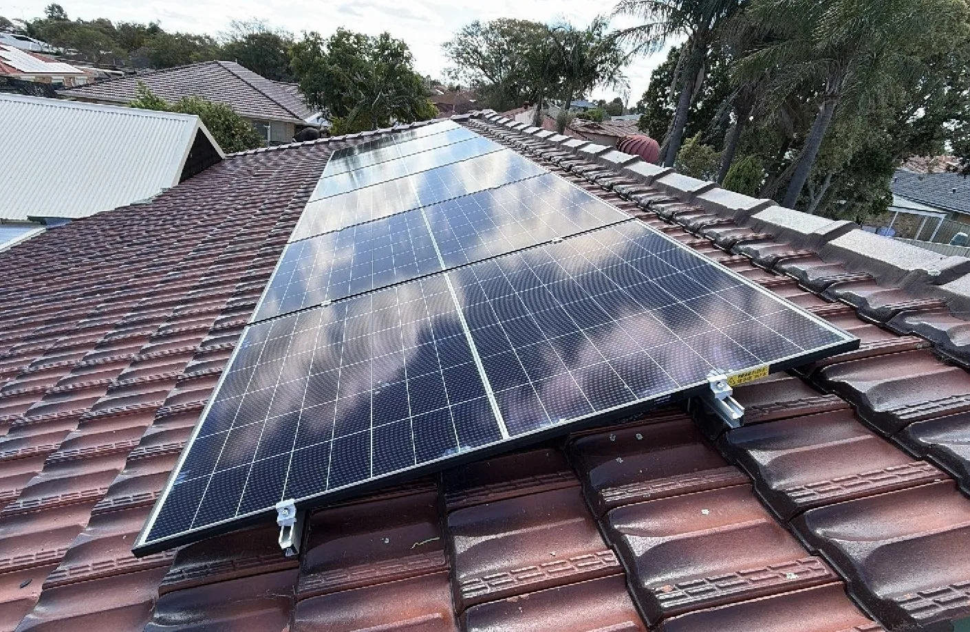 Rows of Trina Vertex S+ panels on a terracotta roof