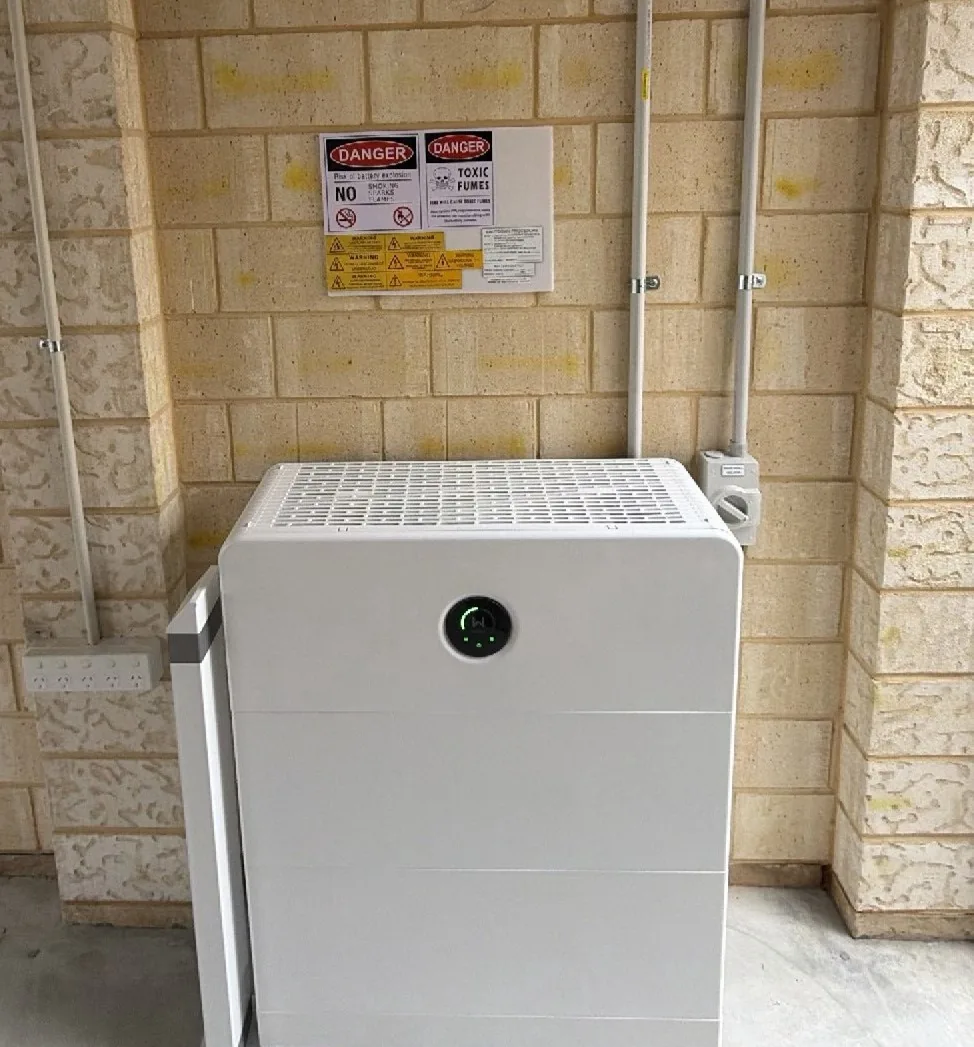 GoodWe ESA 16.64kWh battery in a brick alcove with conduits and bollard