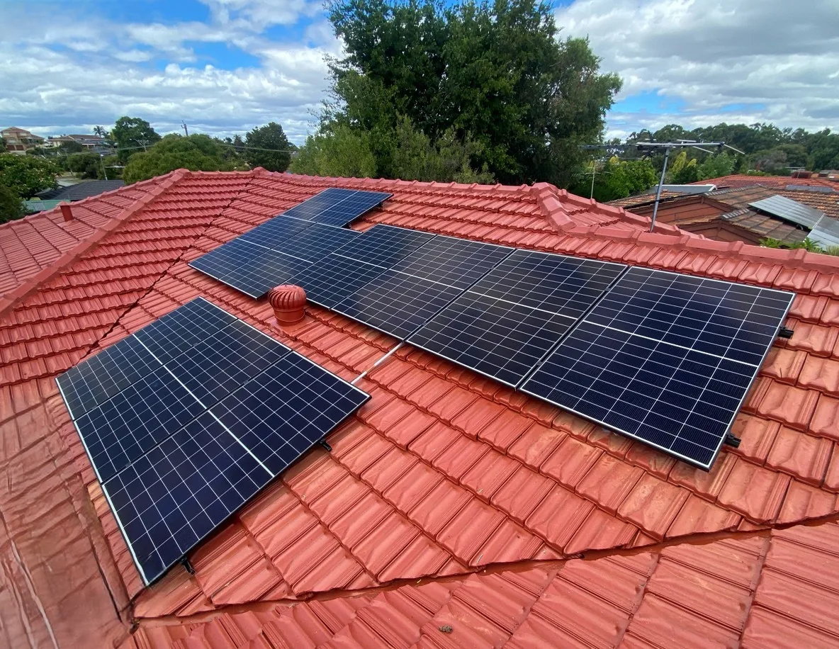 Two groups of solar panels on a terracotta roof in Willetton