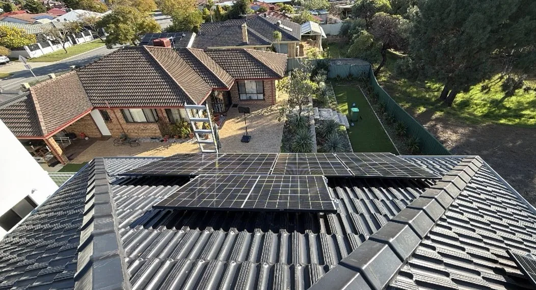 Solar panels on a hipped concrete tile roof in Winthrop