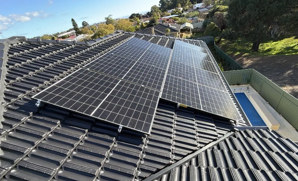 Group of solar panels across the main face of a tiled roof in Winthrop